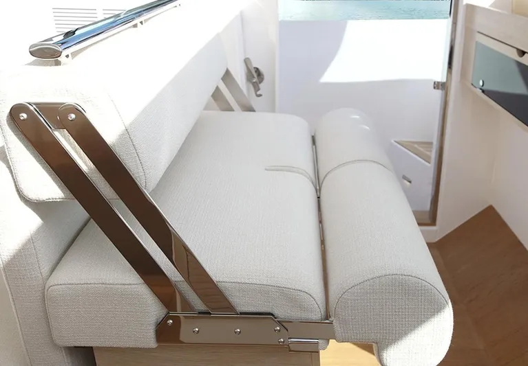  Yacht Photos Pics Interior seating of 2026 Delta Powerboats 48 Coupe, featuring modern design and light upholstery.