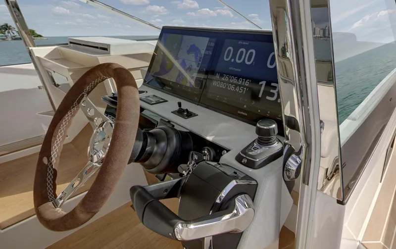  Yacht Photos Pics Helm of 2026 Delta Powerboats 48 Coupe with modern navigation display and controls.