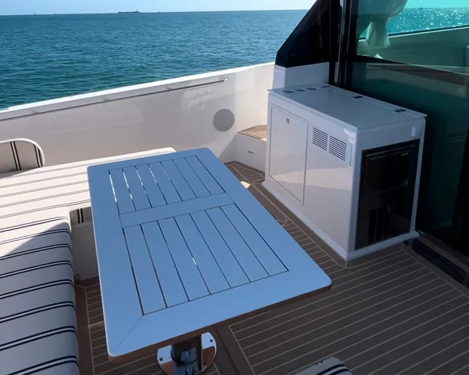  Yacht Photos Pics Luxury deck of 2026 Delta Powerboats 48 Coupe with ocean view and seating area.