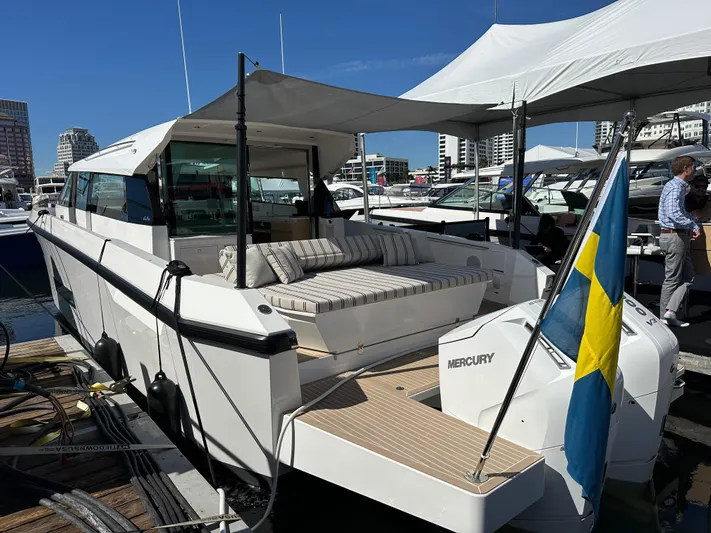  Yacht Photos Pics 2026 Delta Powerboats 48 Coupe docked, featuring sleek design and Swedish flag.