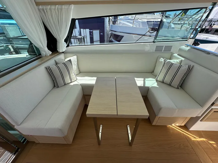  Yacht Photos Pics Interior of 2026 Delta Powerboats 48 Coupe with elegant seating and table arrangement.