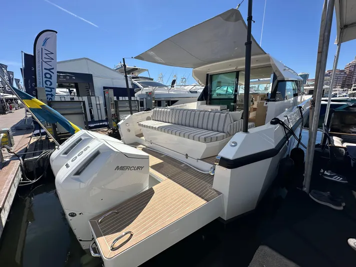  Yacht Photos Pics 2026 Delta Powerboats 48 Coupe docked, featuring spacious deck and Mercury engines.