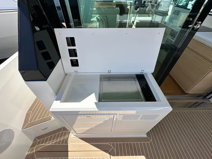  Yacht Photos Pics Outdoor kitchenette on 2026 Delta Powerboats 48 Coupe with sleek design and modern amenities.