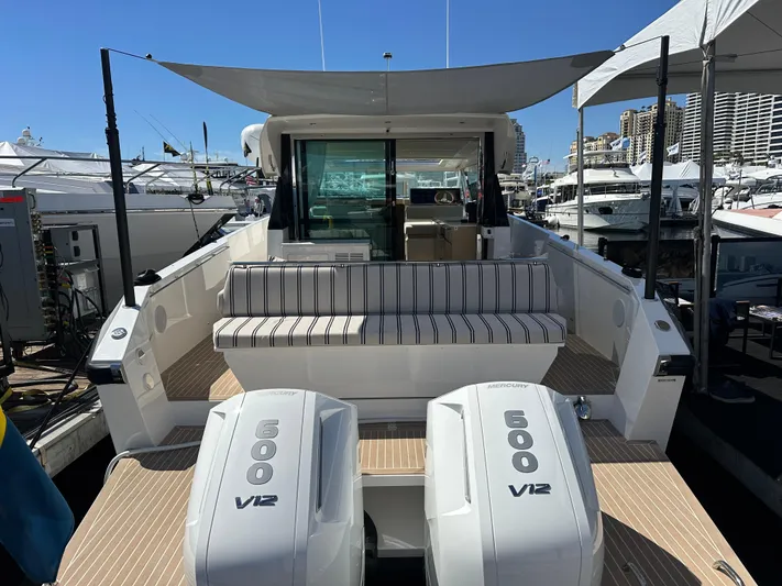  Yacht Photos Pics 2026 Delta Powerboats 48 Coupe with twin V12 engines, docked at a marina.