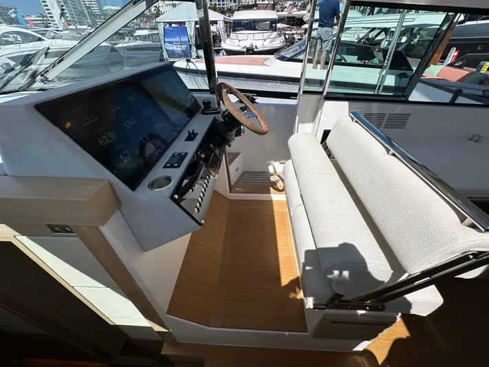  Yacht Photos Pics Interior cockpit of 2026 Delta Powerboats 48 Coupe with modern controls and seating.