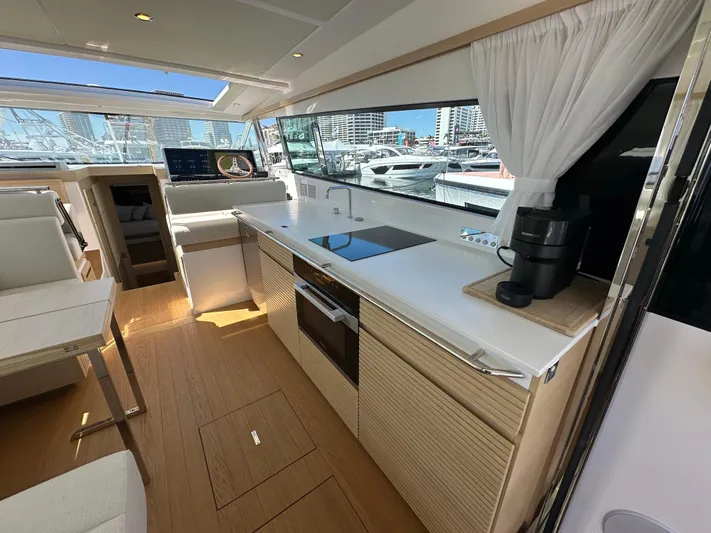  Yacht Photos Pics Modern interior of 2026 Delta Powerboats 48 Coupe with sleek kitchen design.