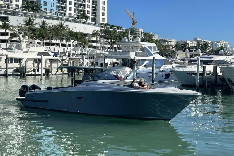  Yacht Photos Pics 2027 Canados Gladiator 431 Walk-around yacht docked in a sunny marina.