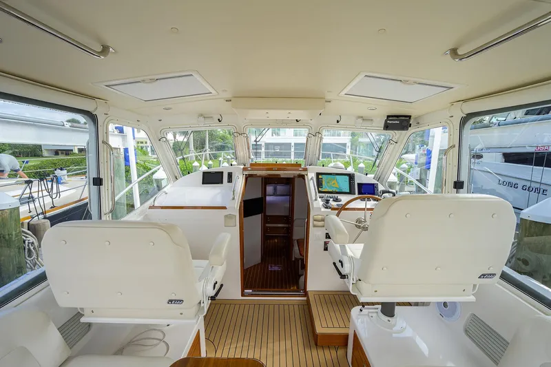 Scout Yacht Photos Pics Interior of 2019 MJM 43z yacht with helm, seating, and navigation equipment.