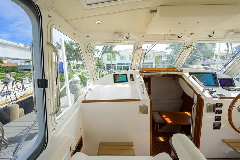Scout Yacht Photos Pics Interior view of 2019 MJM 43z yacht cockpit with navigation equipment and seating.