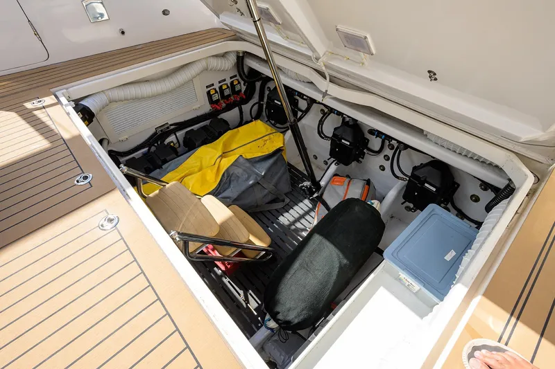 Scout Yacht Photos Pics Open storage compartment on 2019 MJM 43z boat, showing equipment and supplies.