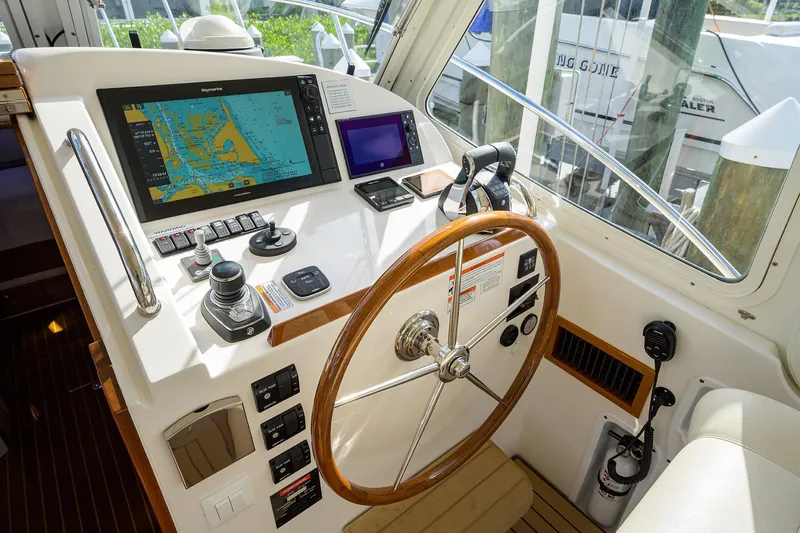 Scout Yacht Photos Pics Cockpit of 2019 MJM 43z yacht with navigation equipment and wooden steering wheel.
