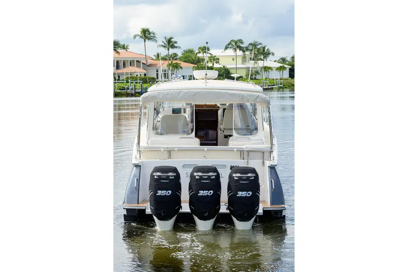 Scout Yacht Photos Pics 2019 MJM 43z boat with triple 350 horsepower engines on a calm waterway.