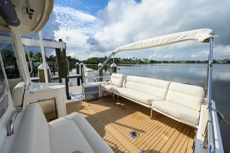 Scout Yacht Photos Pics Luxurious 2019 MJM 43z yacht with spacious deck and comfortable seating by serene waters.