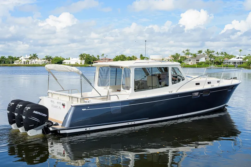 Scout Yacht Photos Pics 2019 MJM 43z boat on calm water with triple Mercury engines.