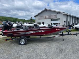 2023 Tracker Pro Team 175 TXW boat on trailer at marina.