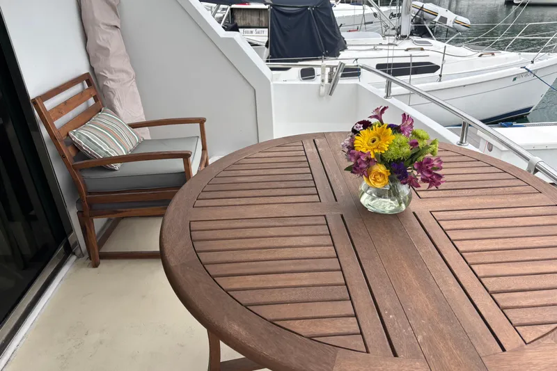  Yacht Photos Pics Wooden deck with flowers on a Maiora Phantom 1986 yacht, overlooking marina.