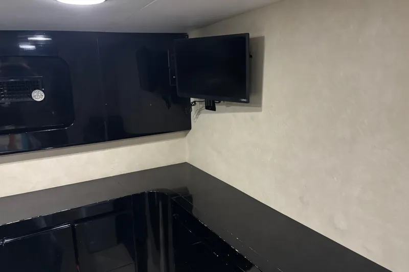  Yacht Photos Pics Interior of a 1986 Maiora Phantom yacht with sleek black and beige design.