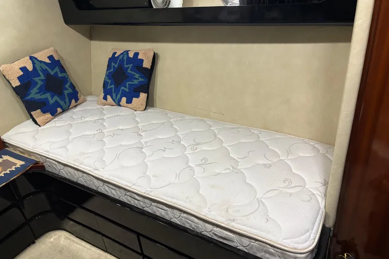  Yacht Photos Pics Cozy cabin bed with patterned pillows in 1986 Maiora Phantom yacht.