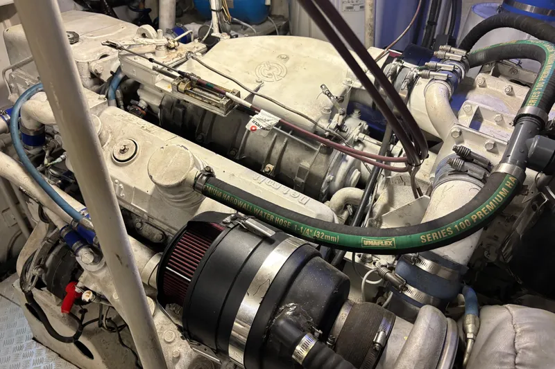  Yacht Photos Pics Engine of a 1986 Maiora Phantom yacht, featuring hoses and mechanical components.