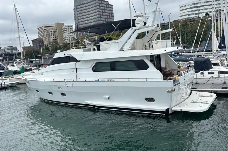  Yacht Photos Pics 1986 Maiora Phantom yacht docked in a marina, surrounded by other boats.