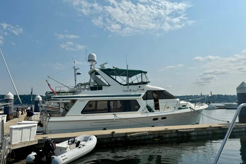 Eagles Soar Yacht Photos Pics 2000 Hampton 490 yacht docked at marina under clear blue sky.