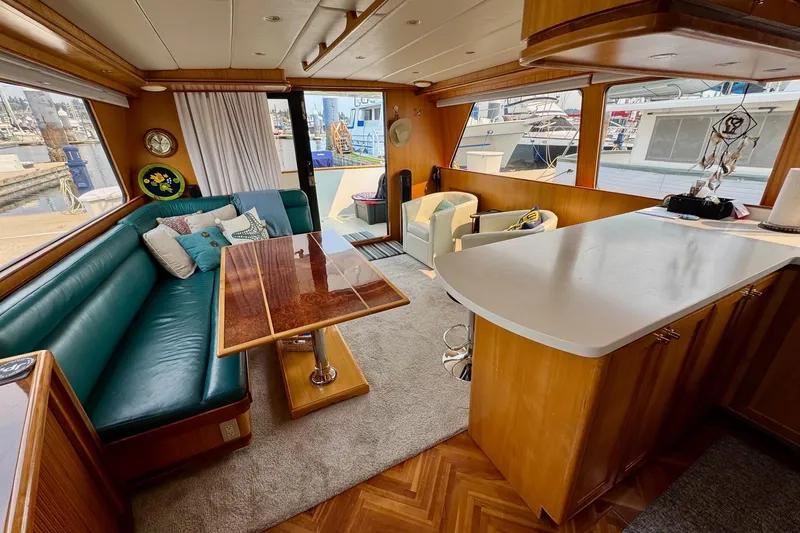 Eagles Soar Yacht Photos Pics Luxurious interior of a 2000 Hampton 490 yacht with elegant seating and dining area.