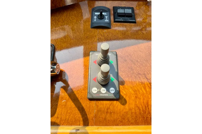 Eagles Soar Yacht Photos Pics Control panel of a 2000 Hampton 490 boat with dual joysticks and switches.