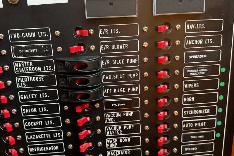 Eagles Soar Yacht Photos Pics Electrical control panel with labeled switches on a 2000 Hampton 490 yacht.