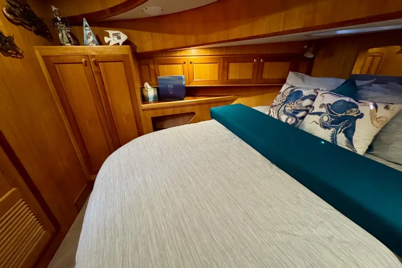 Eagles Soar Yacht Photos Pics Luxurious cabin interior of 2000 Hampton 490 yacht with elegant wood finish.