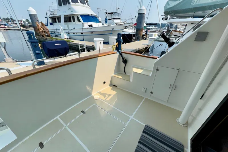 Eagles Soar Yacht Photos Pics Hampton 490 yacht deck, 2000 model, docked at marina with other boats.