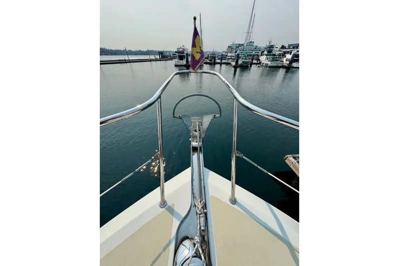 Eagles Soar Yacht Photos Pics Bow view of 2000 Hampton 490 yacht docked in a marina, featuring polished railings.