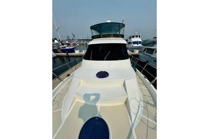 Eagles Soar Yacht Photos Pics 2000 Hampton 490 yacht docked at marina, showcasing sleek design and spacious deck.