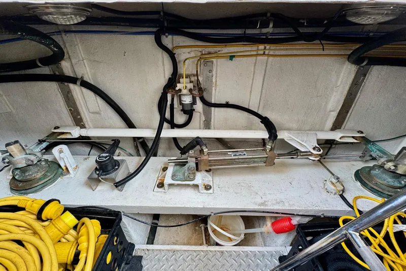 Eagles Soar Yacht Photos Pics Engine compartment of a 2000 Hampton 490 yacht with cables and mechanical components.