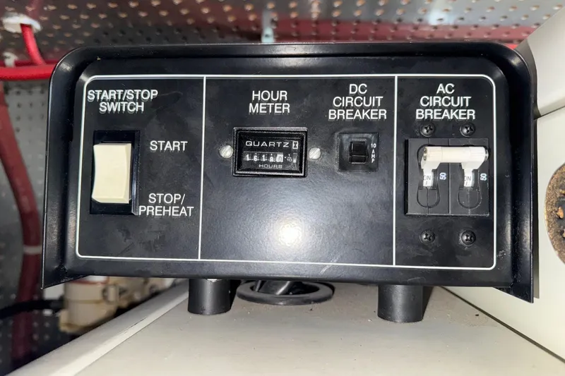 Eagles Soar Yacht Photos Pics Control panel of a 2000 Hampton 490 with switches and circuit breakers.