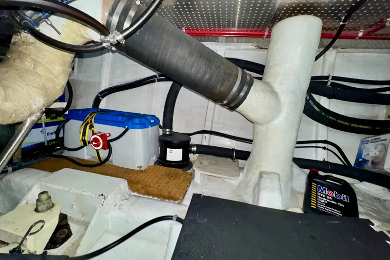 Eagles Soar Yacht Photos Pics Engine room of a 2000 Hampton 490 yacht with battery and hydraulic oil.