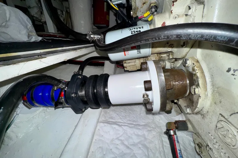 Eagles Soar Yacht Photos Pics Engine compartment of a 2000 Hampton 490 yacht, showcasing mechanical components and hoses.