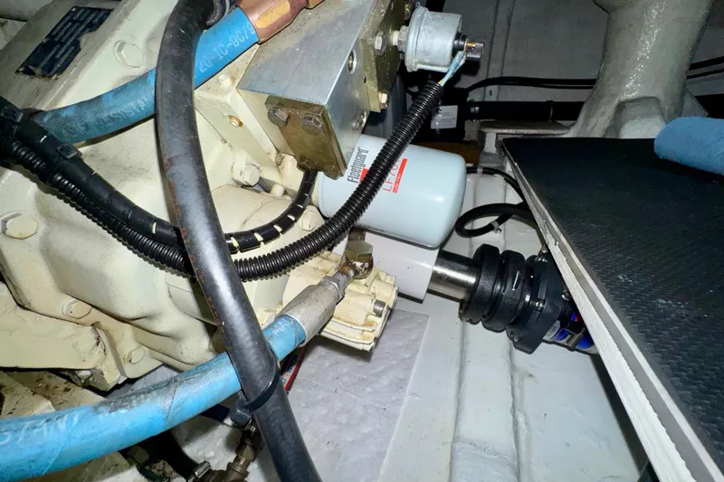 Eagles Soar Yacht Photos Pics Engine compartment of a 2000 Hampton 490 with visible hoses and components.