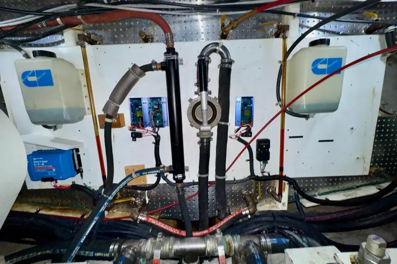 Eagles Soar Yacht Photos Pics Engine room of a 2000 Hampton 490 yacht with mechanical components and wiring.