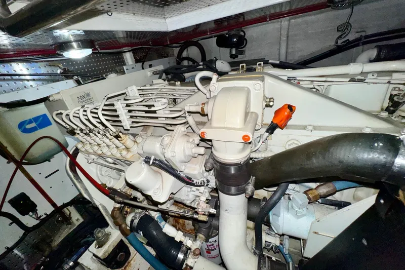 Eagles Soar Yacht Photos Pics Engine room of a 2000 Hampton 490 yacht, showcasing detailed mechanical components.
