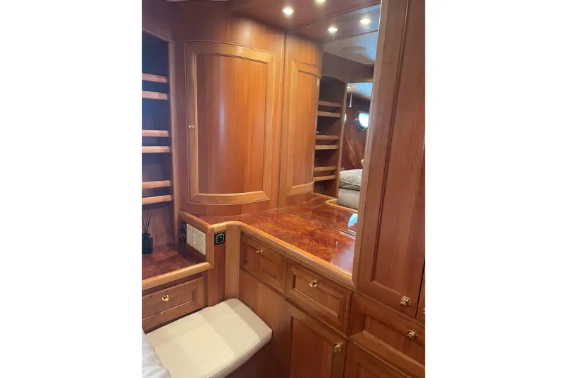 Eagles Soar Yacht Photos Pics Luxurious wooden interior of 2000 Hampton 490 yacht with elegant cabinetry and seating.