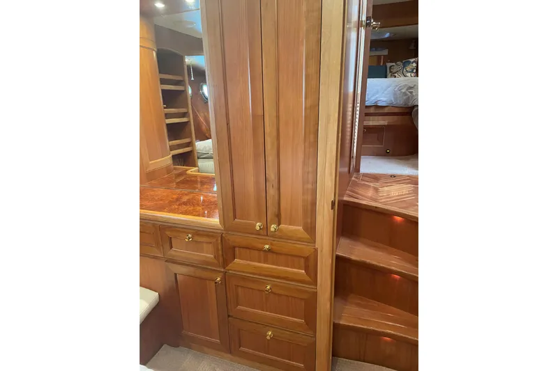 Eagles Soar Yacht Photos Pics Luxurious wooden interior of 2000 Hampton 490 yacht with cabinets and stairs.