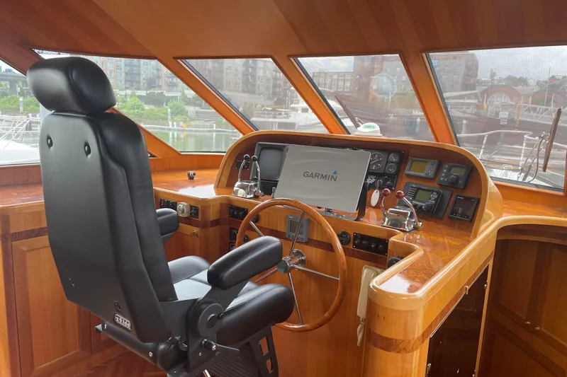 Eagles Soar Yacht Photos Pics Helm of 2000 Hampton 490 yacht with Garmin navigation system and luxurious wood finish.