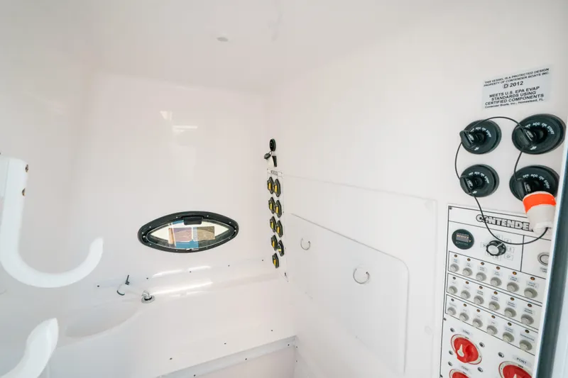  Yacht Photos Pics Interior of 2023 Contender 39 ST boat with control panel and porthole.