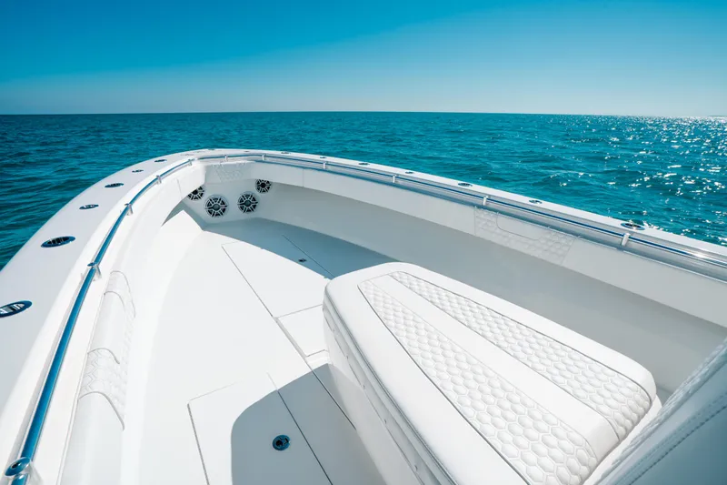  Yacht Photos Pics 2023 Contender 39 ST boat on open sea, featuring sleek white design and spacious deck.