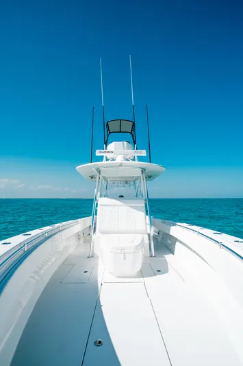  Yacht Photos Pics 2023 Contender 39 ST boat on open sea under clear blue sky.