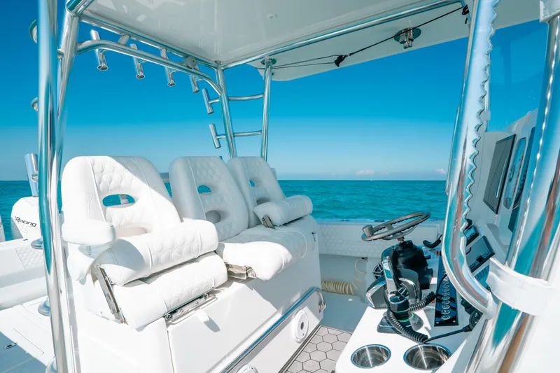  Yacht Photos Pics 2023 Contender 39 ST boat interior with white seating and ocean view.