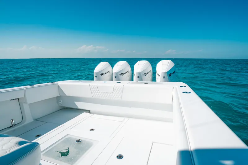  Yacht Photos Pics 2023 Contender 39 ST boat with four engines on open sea.