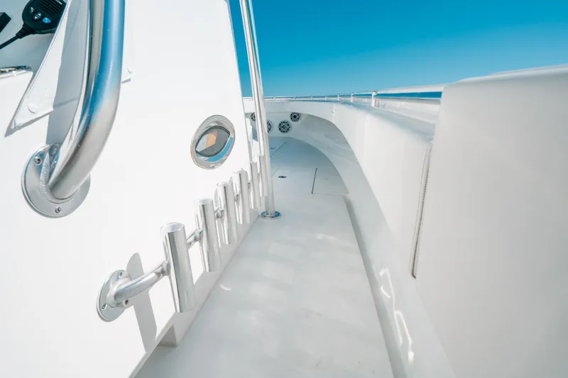  Yacht Photos Pics 2023 Contender 39 ST boat deck with stainless steel fittings and clear blue sky.