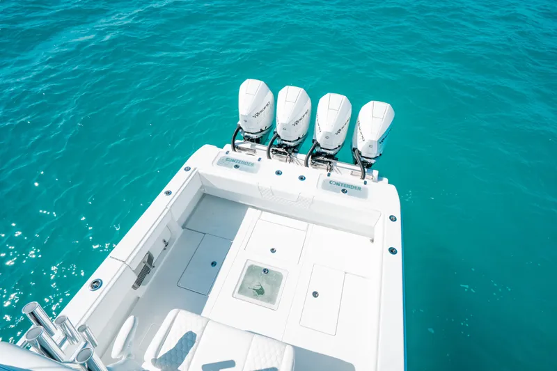  Yacht Photos Pics 2023 Contender 39 ST boat with four engines on turquoise water.