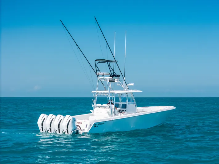  Yacht Photos Pics 2023 Contender 39 ST boat with four engines on open sea.